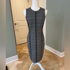 Classic and flattering houndstooth shift with leather detailing by J McLaughlin